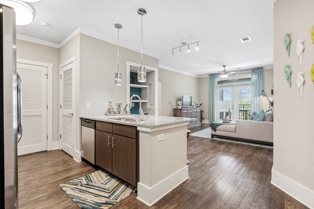 a renovated kitchen and living room in a new home