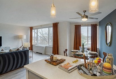 a living room and dining room with a table with food on it