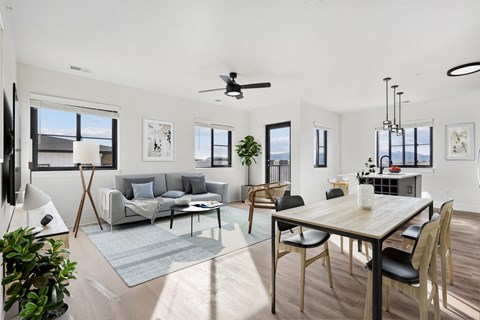 a living room with a couch and a dining room table