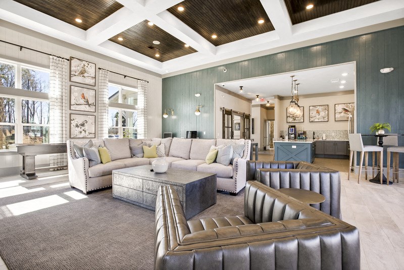 a large living room with couches and a coffee table