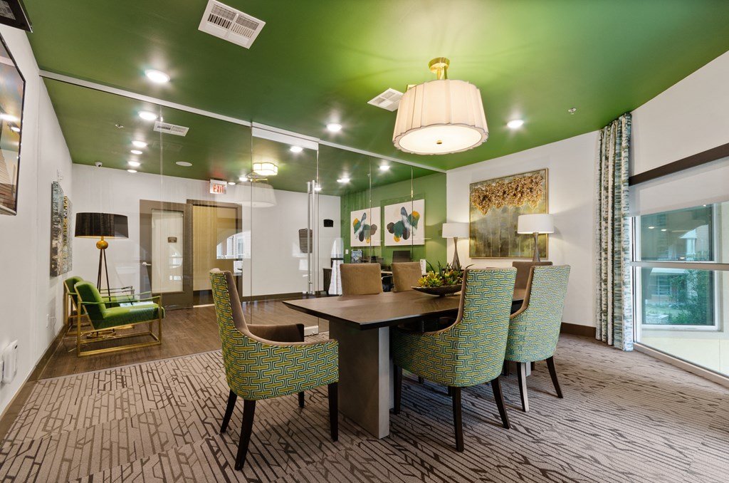 a dining room with a table and chairs