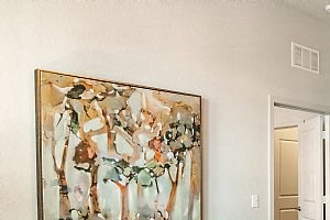a living room with a couch and a glass table