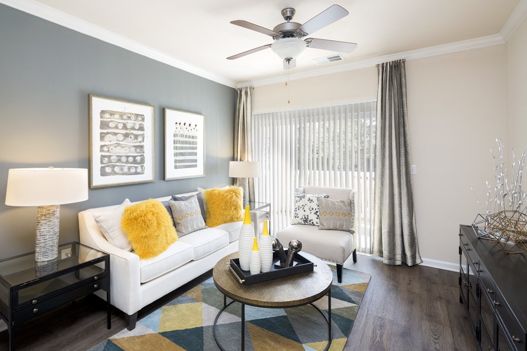 a living room with a white couch and a coffee table