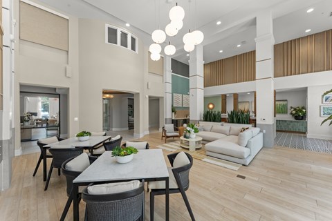 A modern dining area with a table set for six.