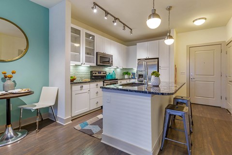 a kitchen with an island and a counter top