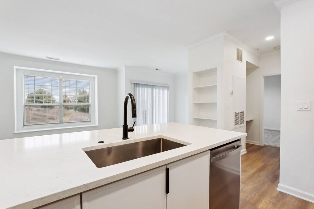 a kitchen with a large sink and a window