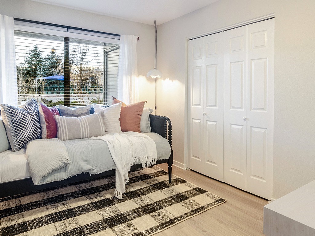 a living room with a couch and a window