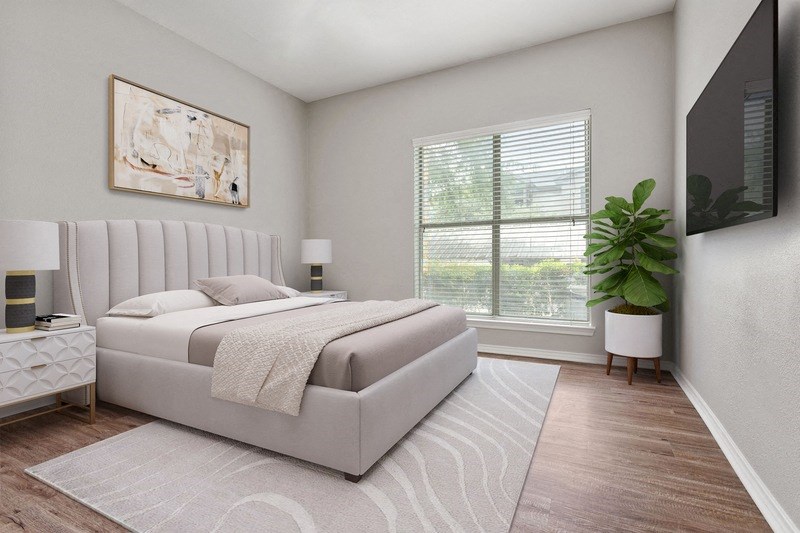 a bedroom with a bed and a large window