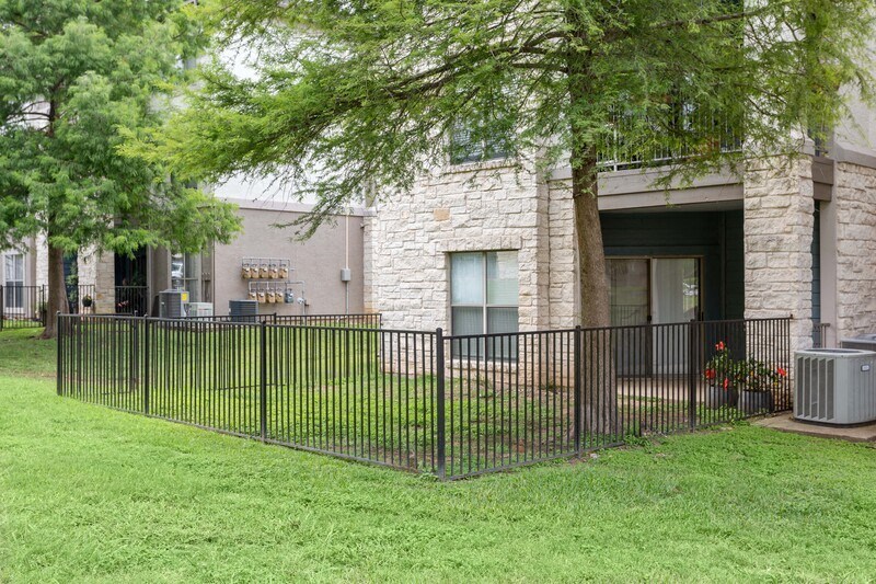a building with a fence in front of it