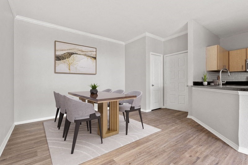 a kitchen and dining area in a 555 waverly unit