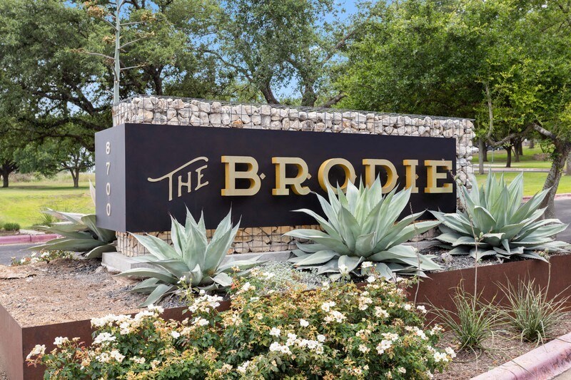 a sign for the brodie apartments