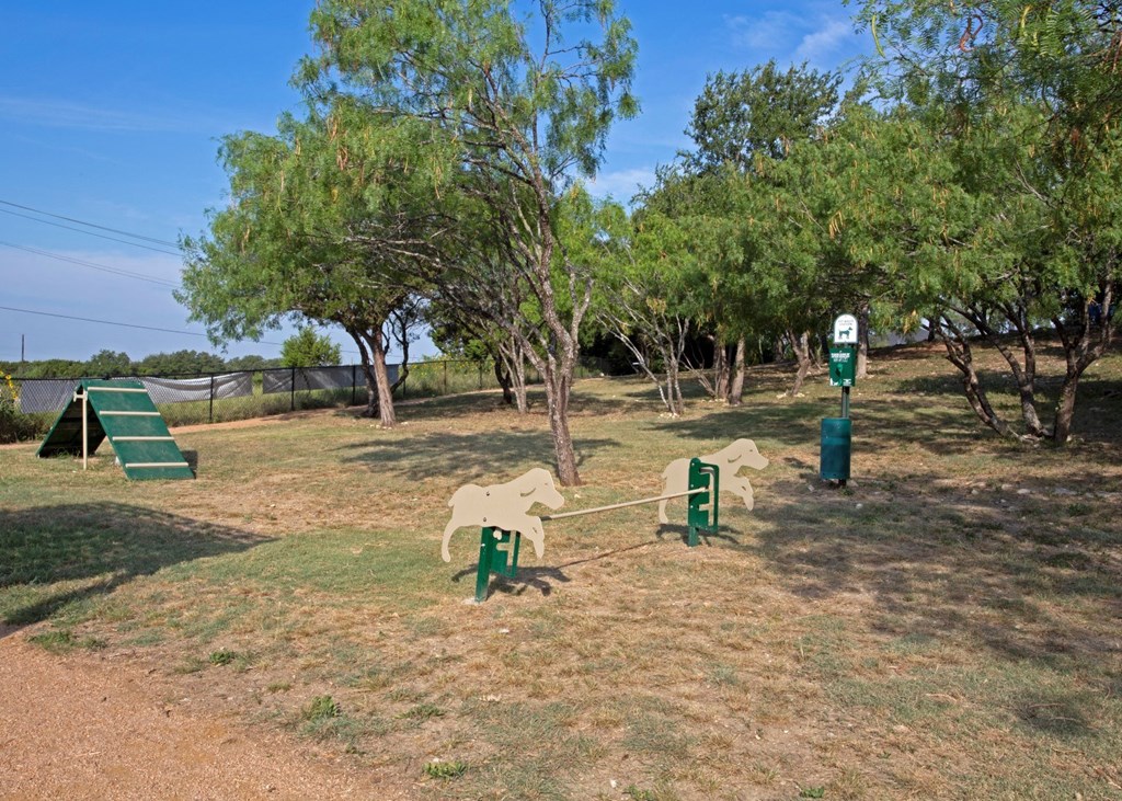 a park with a horse playground and trees