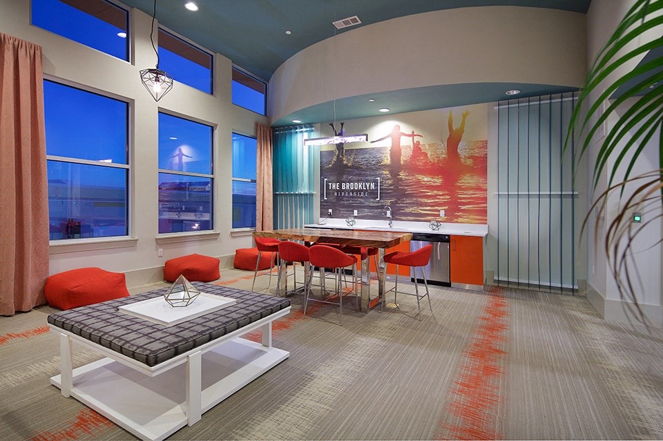 A conference room with a long table and chairs.