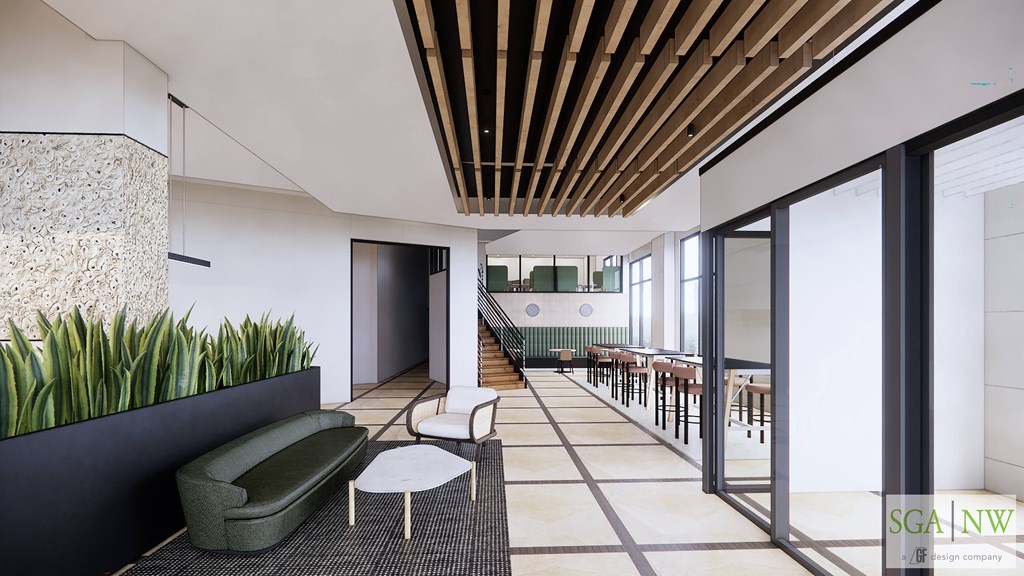 a lobby with chairs and tables and a staircase