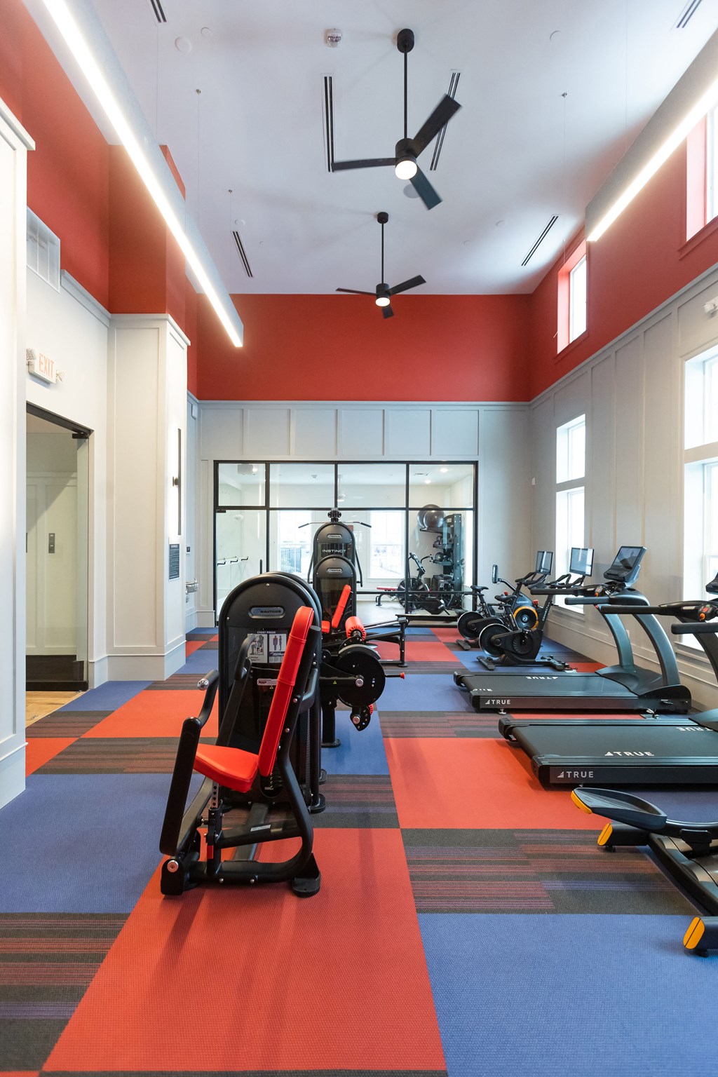 a gym with cardio equipment and exercise machines