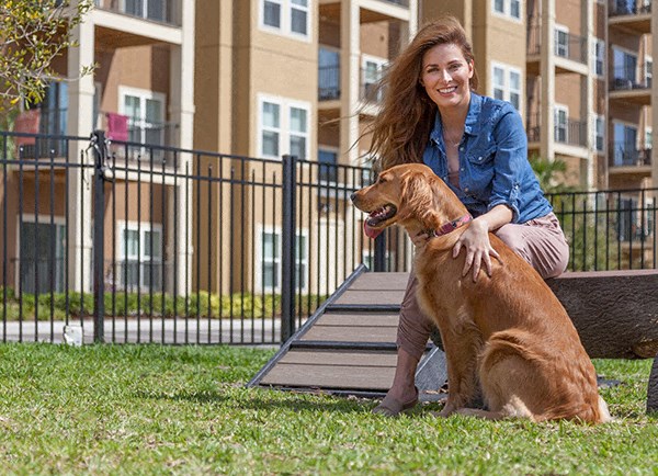Woman with Dog at Dog Park