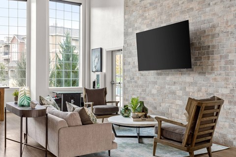 a clubhouse with a fireplace and a tv on the wall