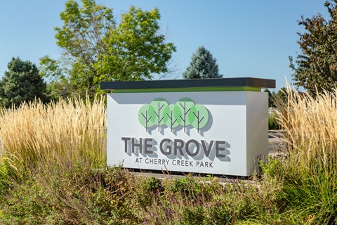 a sign for the grove at cherry creek park