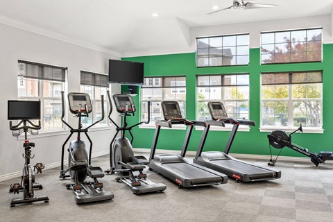 the gym with treadmills and other exercise equipment