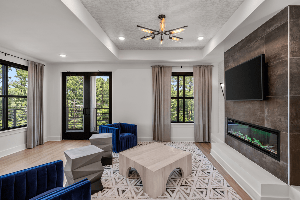 A modern living room with a fireplace and a television.