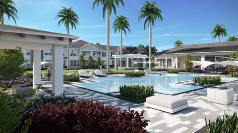 A pool surrounded by palm trees and a white building.