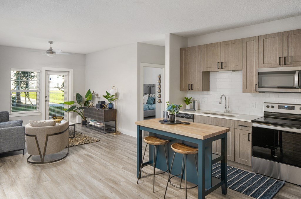 an open floor plan with a kitchen and living room