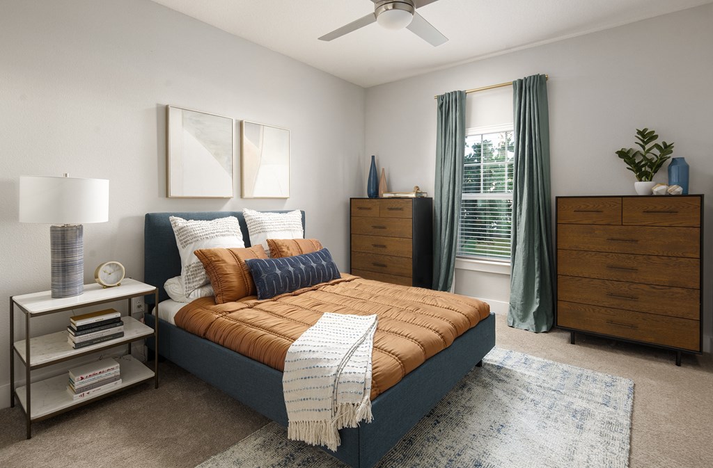 a bedroom with a bed and dresser