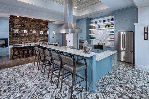 The clubhouse kitchen with a big island and barstools