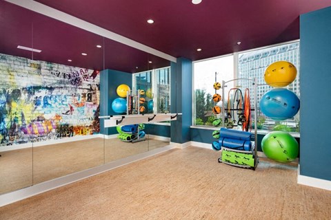 Picture of the fitness center yoga room with wrap around mirror walls