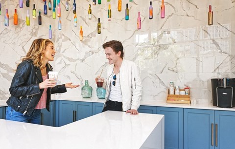 A stock photo of people enjoying the table in the lounge