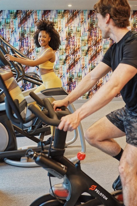 Stock photo of people using the bikes at the fitness center