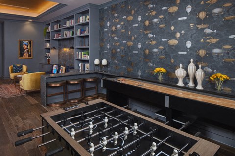 A lounge with a foosball table