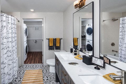 Bathroom with a vanity that includes two sinks