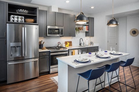 Kitchen with an island and barstools