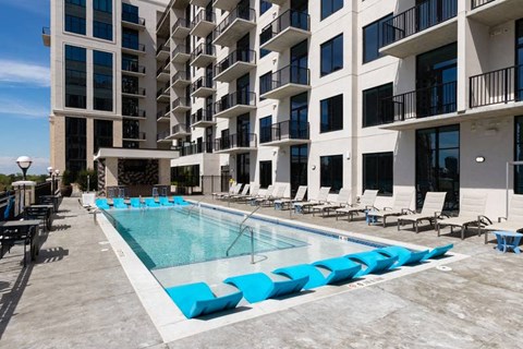 Pool photo with lounge chairs in the water