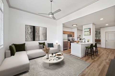 A modern living room with a grey sofa and a coffee table.