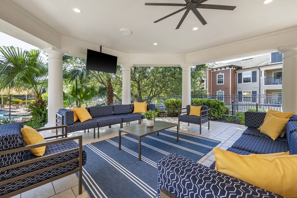 exterior resident lounge with seating and tv