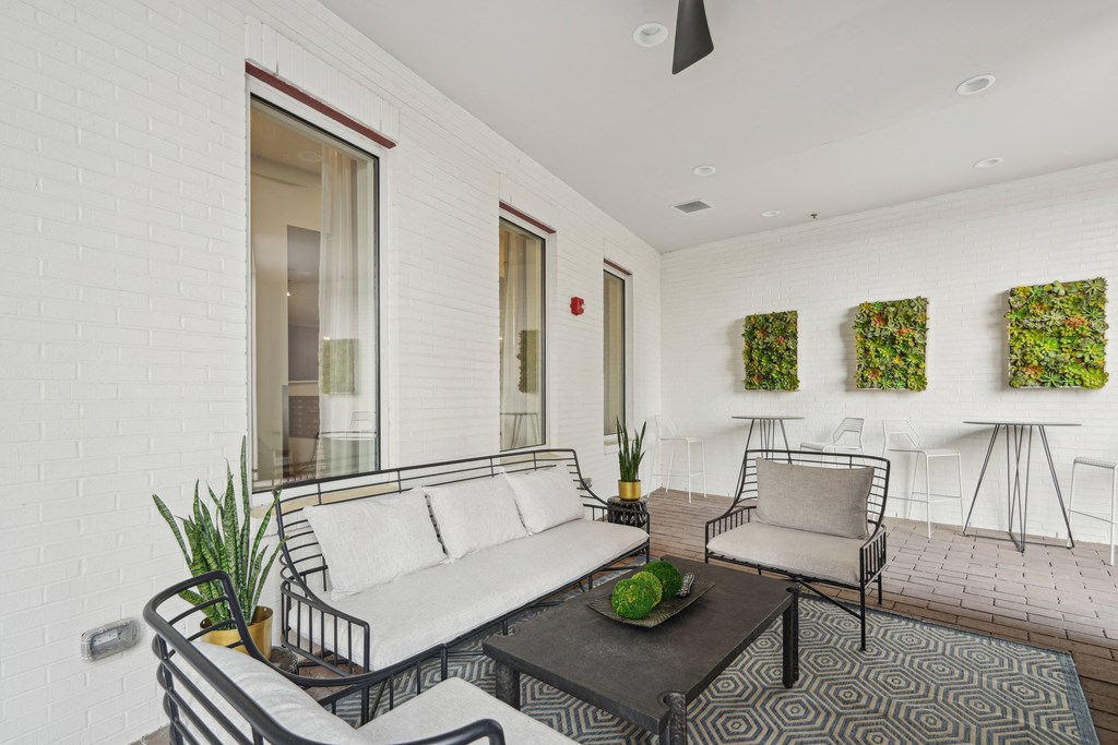 a living room with a couch and two chairs