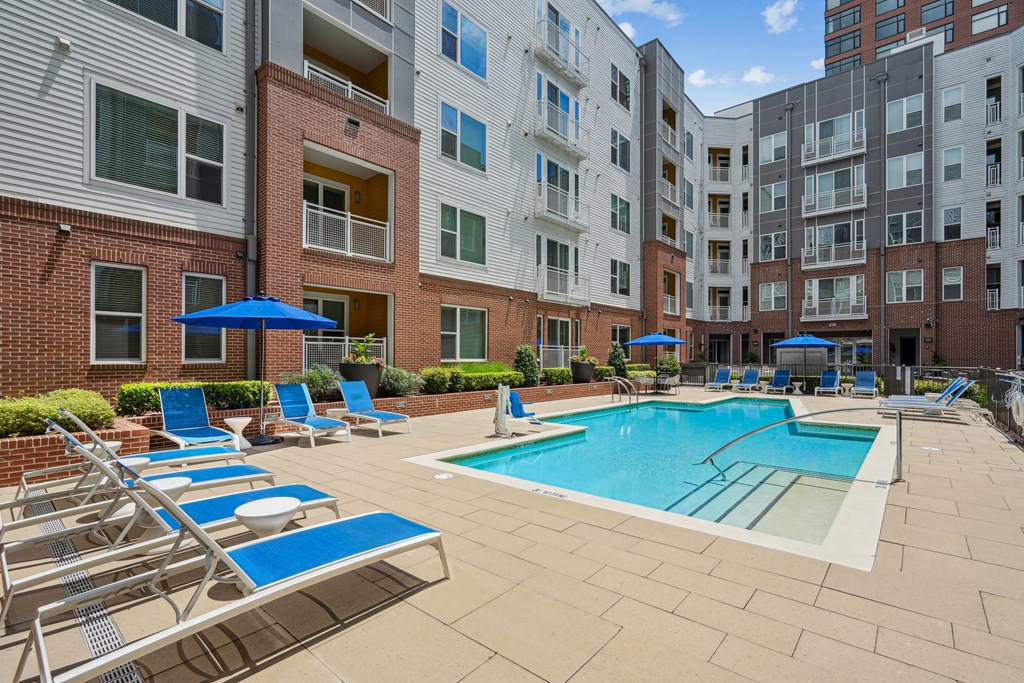 our apartments offer a swimming pool with chairs and umbrellas