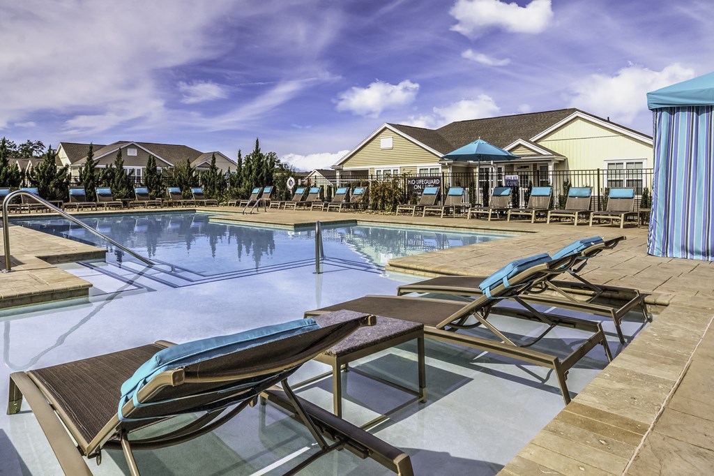 exterior community pool with seating