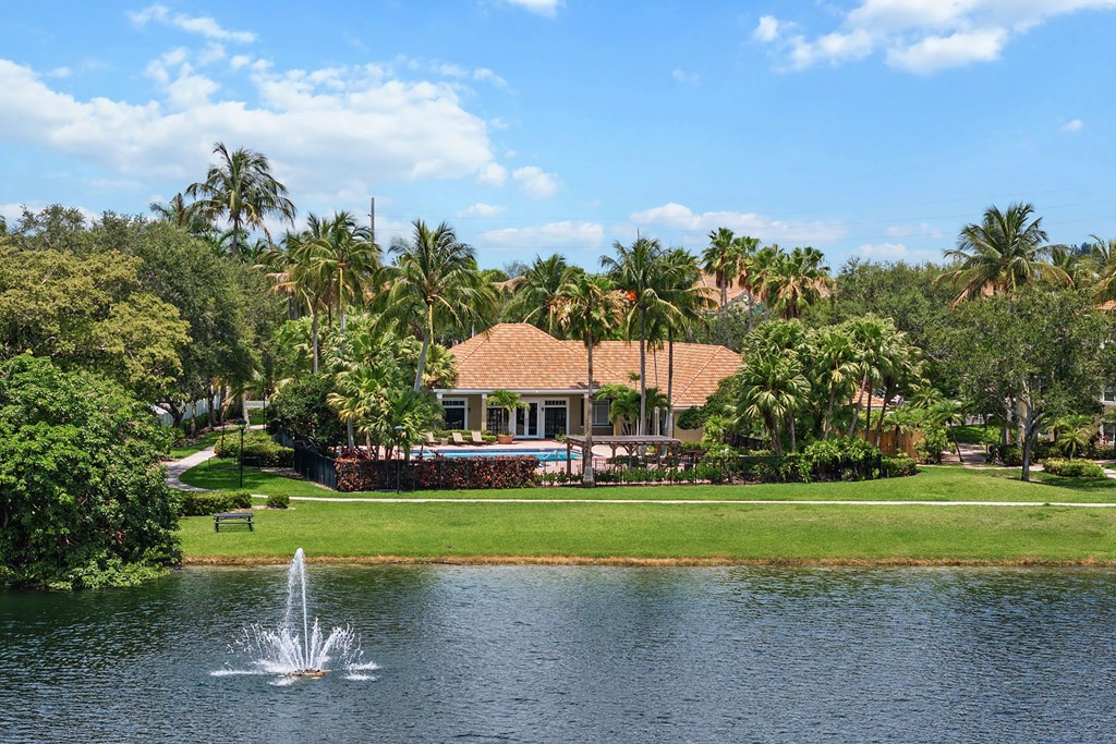 A building with a fountain in front of it.