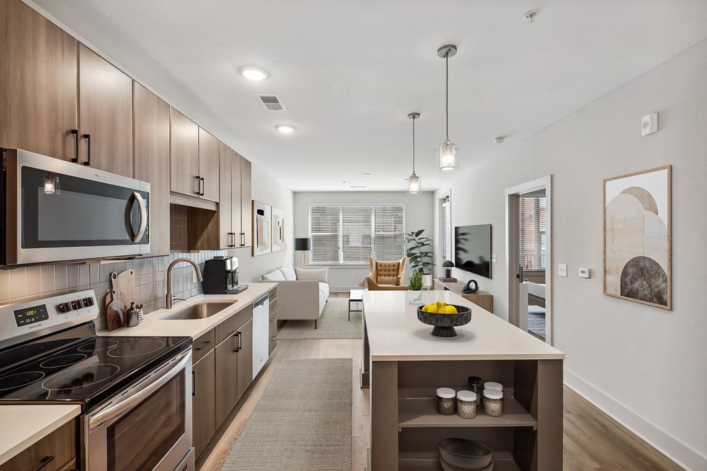 an open kitchen and living room with a dining area and a living room