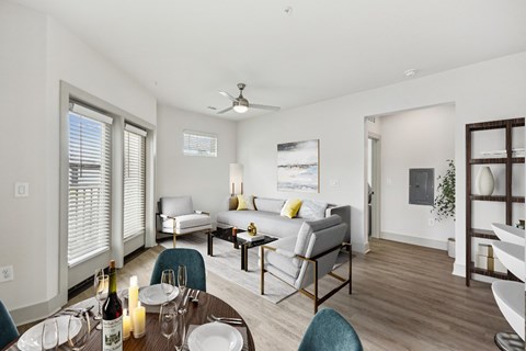 a living room and dining room with a couch and a table