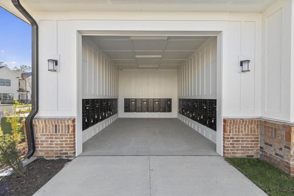 An open area with black mailboxes.