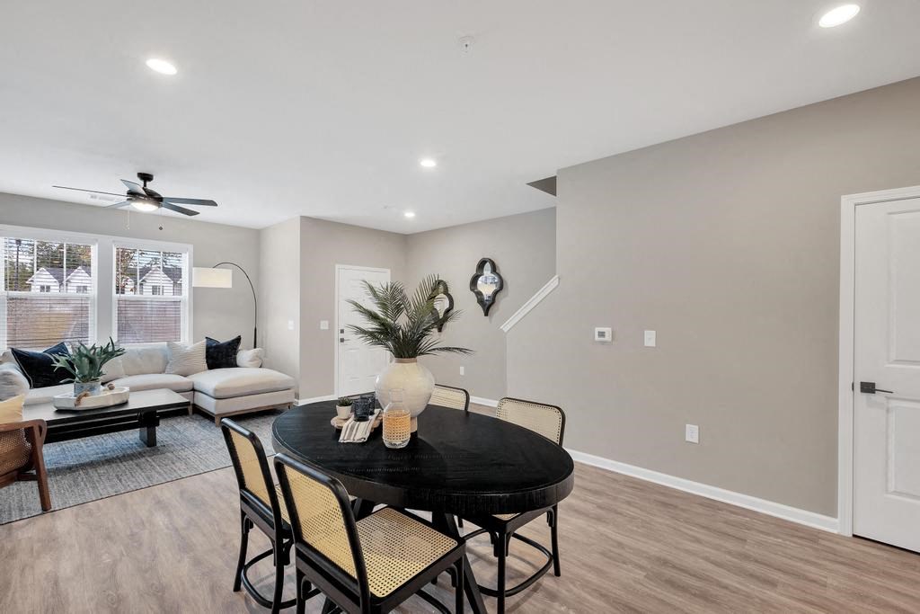 a dining room with a table and chairs