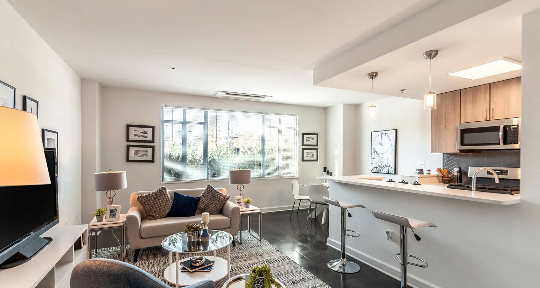 Dominion Living Room With Partial Kitchen Views