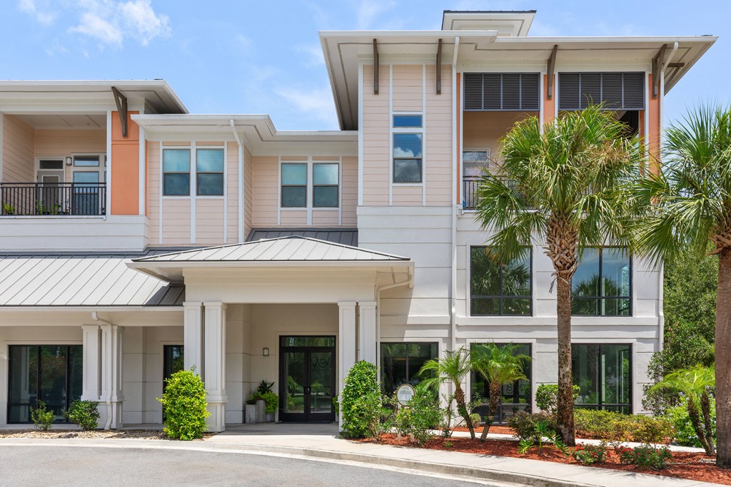 a building with palm trees in front of it