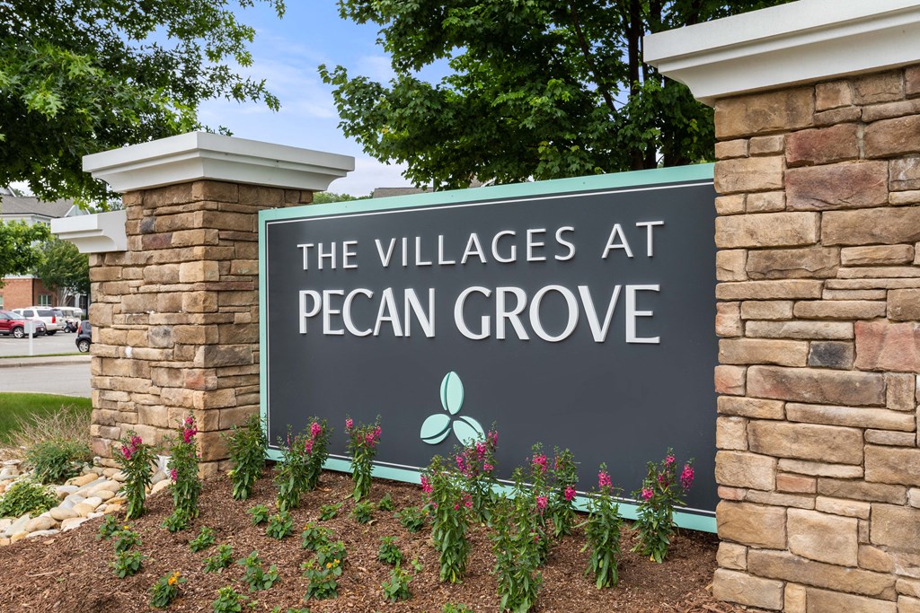 a sign for the villages at pecan grove
