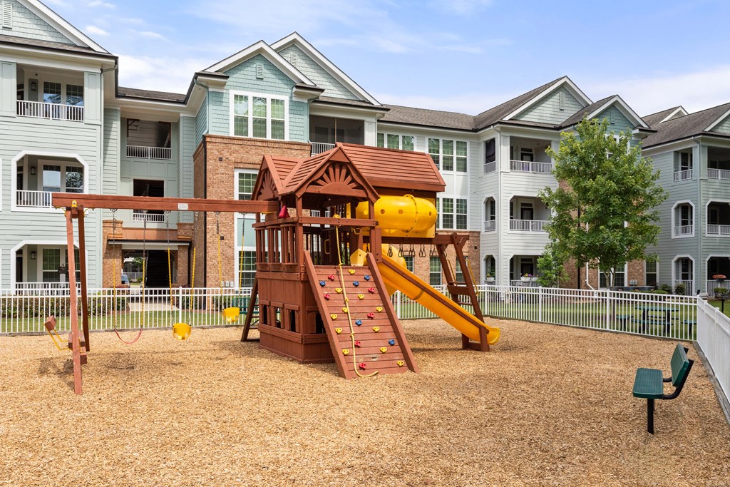 a playground at the flats at big tex apartments in san antonio, tx