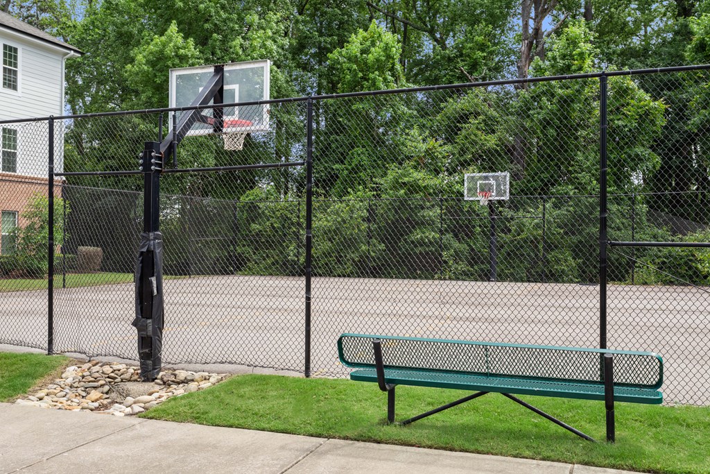 a basketball court with a bench in front of it